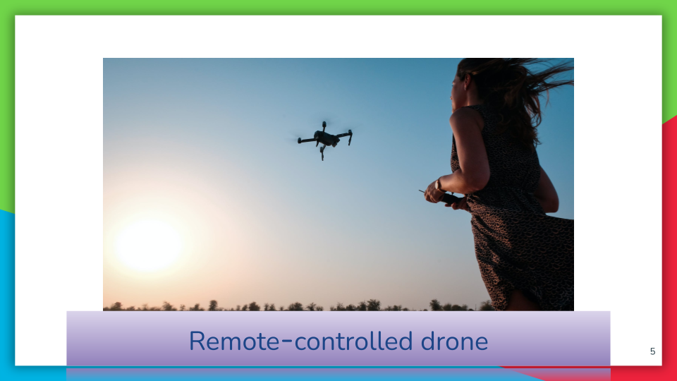 woman using a remote control to fly a drone